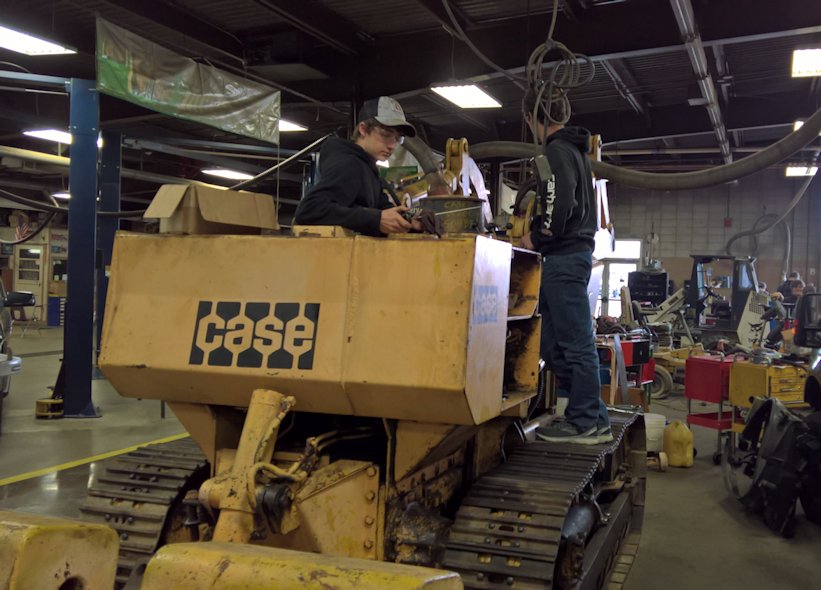 Students in School Activites (Athletics, Classrooms, Plays, Band, Art Projects) (PHS Students at Heartland Career Center working on a Case Tractor.jpg)